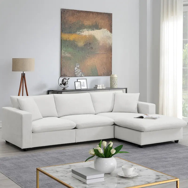Canapé d'angle en forme de L « Cloud » avec coussins décoratifs, pouf et assise large